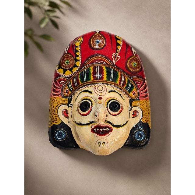 A highly expressive vintage Nepalese papier-mâché mask, likely originating from the Kathmandu Valley and reflecting the...