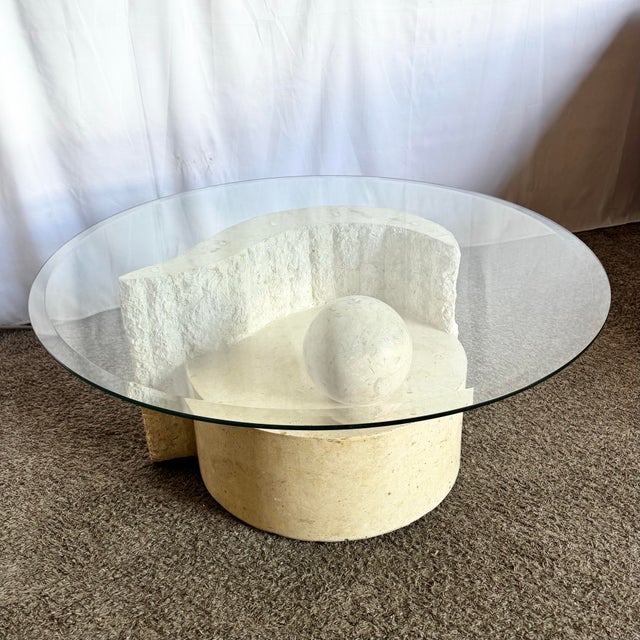A sculptural marvel in stone and glass, this postmodern coffee table blurs the line between furniture and art. Crafted...