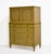 Mid century Directoire style highboy dresser by John Widdicomb with a blonde wood finish and a tall, stepped case. Two...