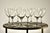 A set of eight French crystal white wine glasses by Baccarat, each signed on the underside of the foot with the acid-...