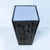 1980s postmodern pedestal, with a textured black and gray finish. This piece has a white acrylic top that can be...