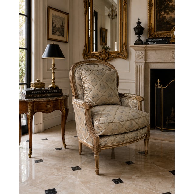 Elegant Wesley Hall armchair inspired by classic Louis XVI design, featuring a carved exposed wood frame with fluted legs,...