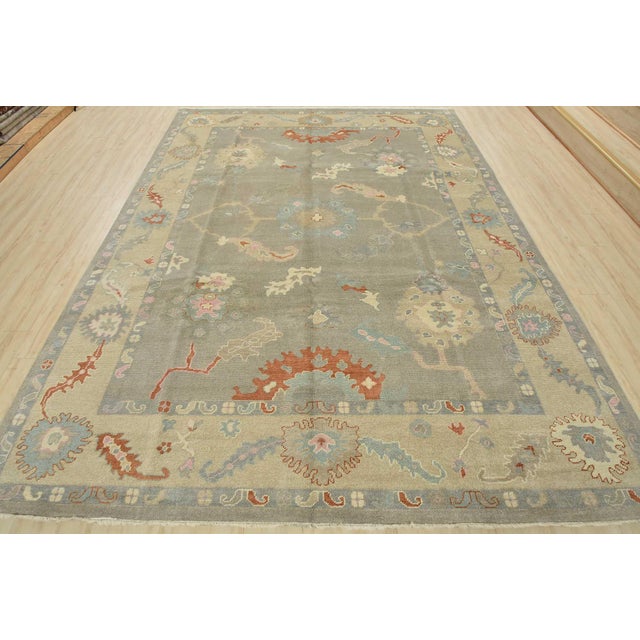 This modern traditional Anatolia rug is hand-knotted with an all-wool pile on a cotton foundation. This rug is new and in...