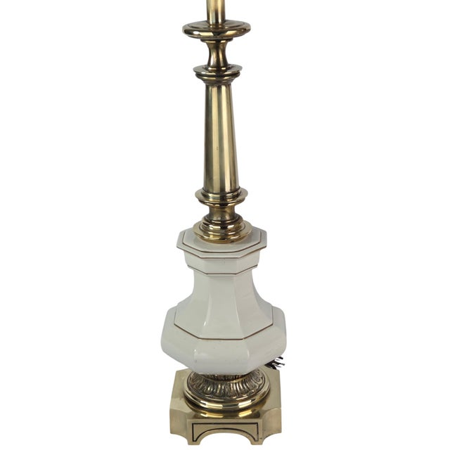 A pair of vintage Stiffel table lamps in a Neoclassical, Empire-influenced urn form. Each features a hand-painted floral...