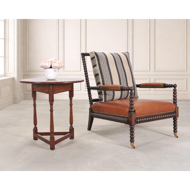 A handsome round cricket side table or pub drinks made by Theodore Alexander for Ralph Lauren in an English Country...