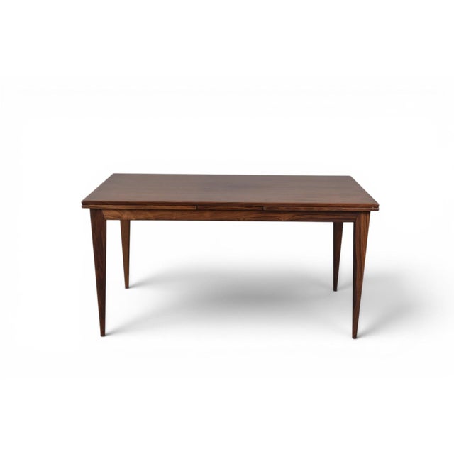Designed by Niels Otto Møller for JL Møller, this 1960s Danish dining table showcases beautifully grained rosewood and the...