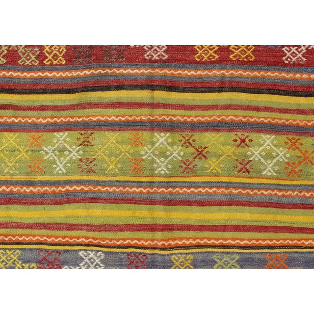 Yellow Vintage Turkish Kilim Rug in Yellow, Red, Green, and Blue With Tribal Motifs For Sale - Image 8 of 13