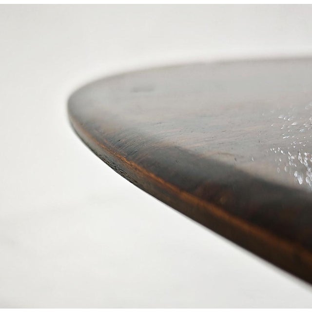 The iconic Model T69 round dining table, designed in the early 1960s by Osvaldo Borsani and Eugenio Gerli for the renowned...