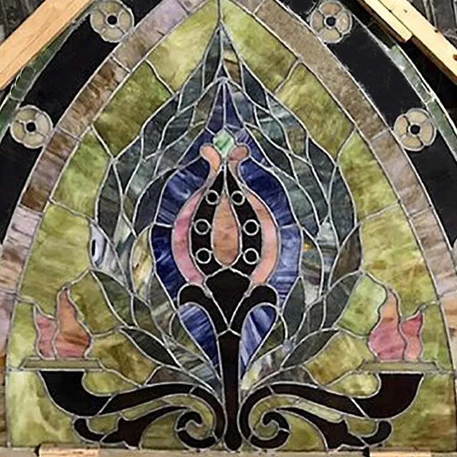 Antique, Beaux Arts style pointed arch, polychrome stained and slag glass window panel. This stunning window has beautiful...