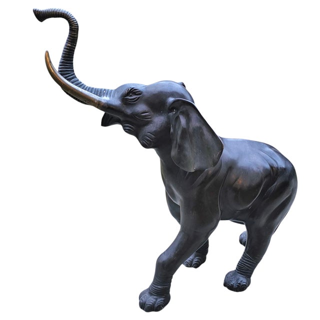 This Vintage Bronze Elephant Statue exemplifies exceptional artistry with its majestic form and striking realism. Robust...