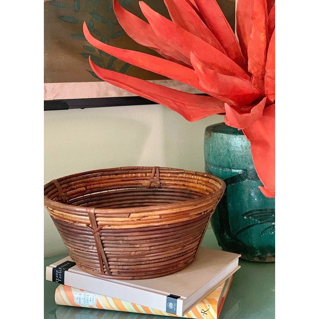 Italian ‘Gabriella Crespi’ Style Mid-Century Pencil Reed Rattan Coiled Bowl, Basket. This handcrafted bowl has a beautiful...