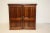A handsome campaign-style mahogany desk cabinet featuring a fully fitted interior with drawers, letter slots, and...