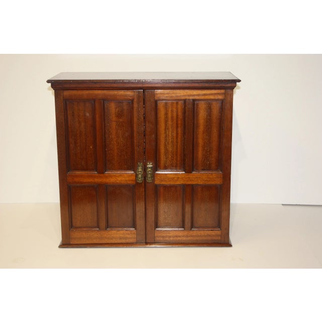 Handsome 19th-century campaign mahogany cabinet with fitted letterbox interior. A perfect accent to hang near a writing...