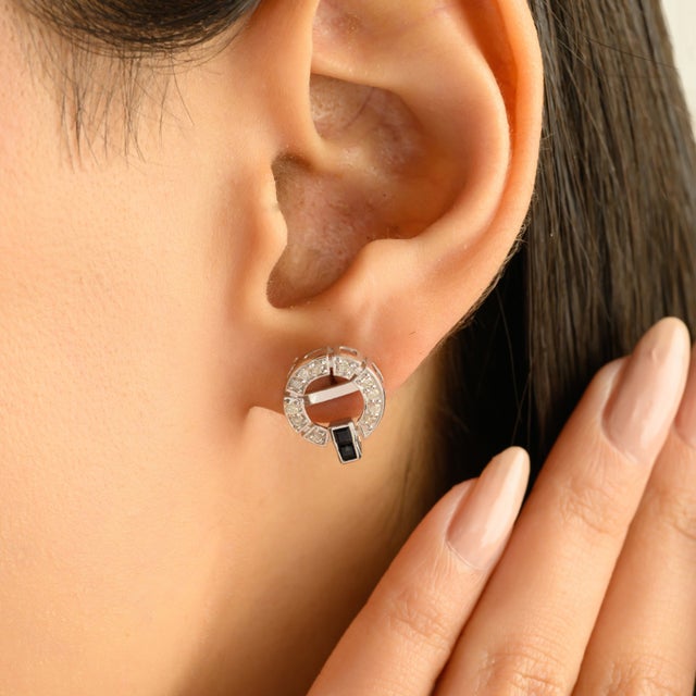 Elevate your jewelry collection with these refined Art Deco–inspired silver earrings, featuring a striking circular design...