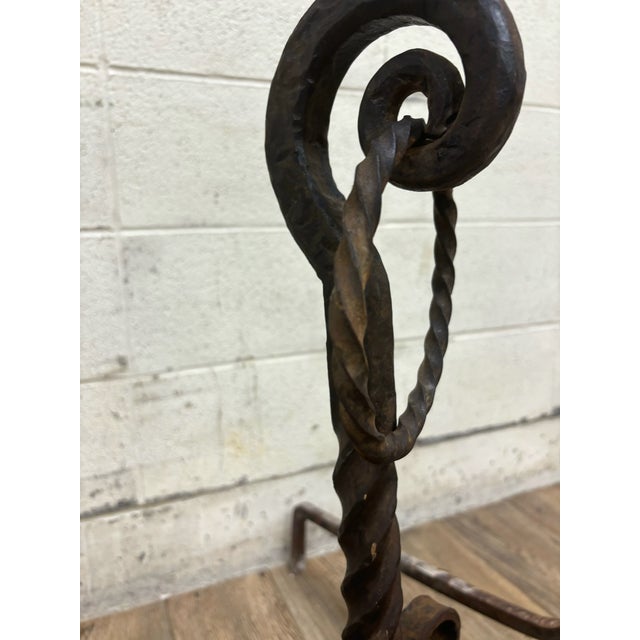 This is a stunning pair of vintage, possibly antique, possibly hand forged scrolled wrought iron fireplace andirons or...