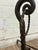 This is a stunning pair of vintage, possibly antique, possibly hand forged scrolled wrought iron fireplace andirons or...