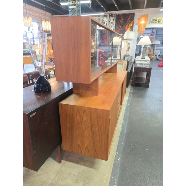 Stunning mid-century modern 2 piece credenza and hutch combo, featuring clean architectural lines, rich warm grain, and...