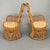 A pair of vintage armchairs designed by Luigi Caccia Dominioni in the 1960s. The frame is made of bamboo and wicker, with...
