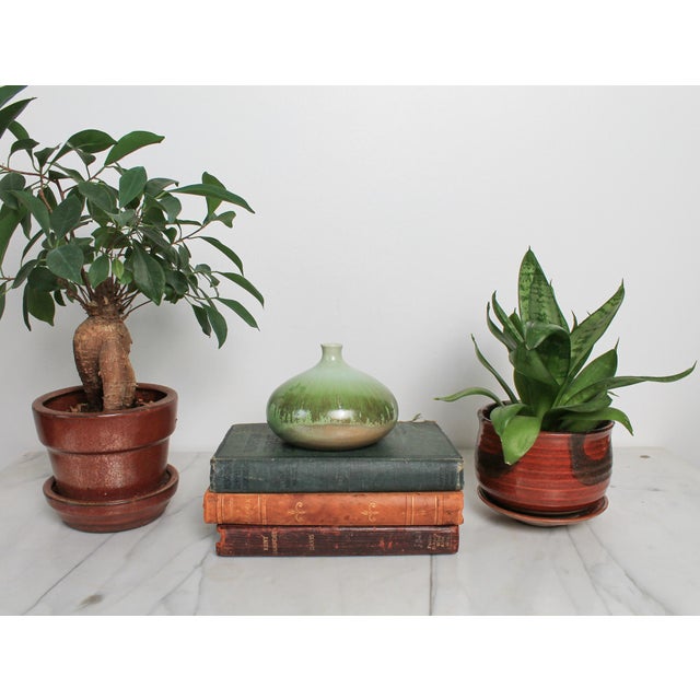 Vintage glazed pottery bud vase by Raymor. Made in Italy. Makers mark on bottom. Minor age wear. No chips or cracks.