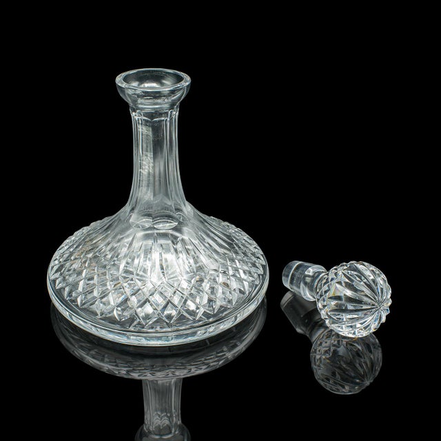 This is a vintage ship's Merlot decanter. An English, cut crystal glass full bodied wine or spirit vessel, dating to the...