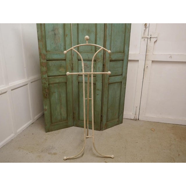 Unusual floor standing suit hanger or dumb valet. A very useful piece, the hanger or clothes stand is painted shabby...