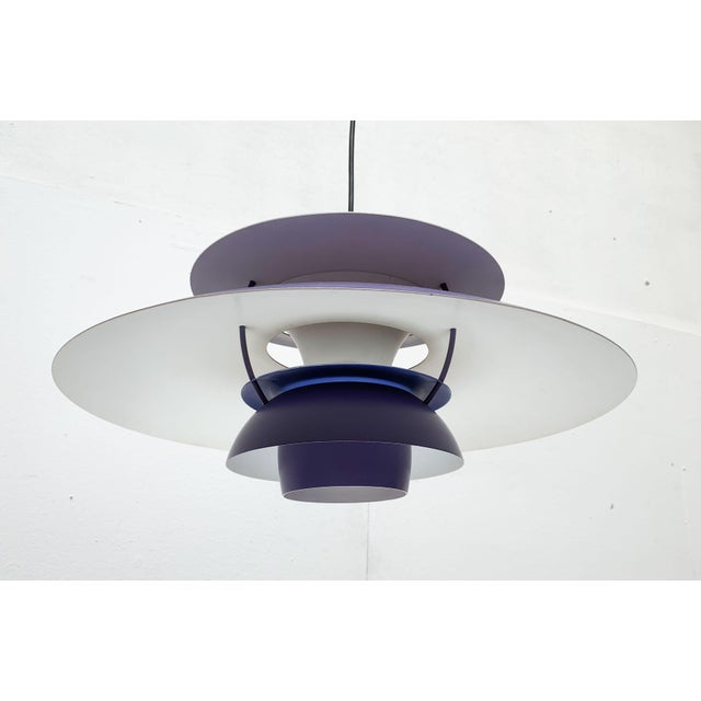 The classic PH5 pendant light from Poulsen according to a design by Poul Henningsen from the 1950s. Here in the rare,...