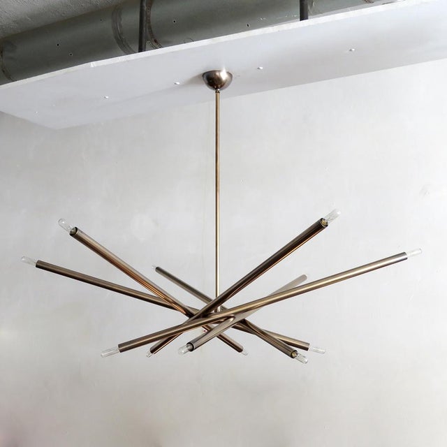 Stunning extra large six-arm, twelve-light chandelier by Gallery L7 in raw aged brass, upper diameter 60″, lower diameter...