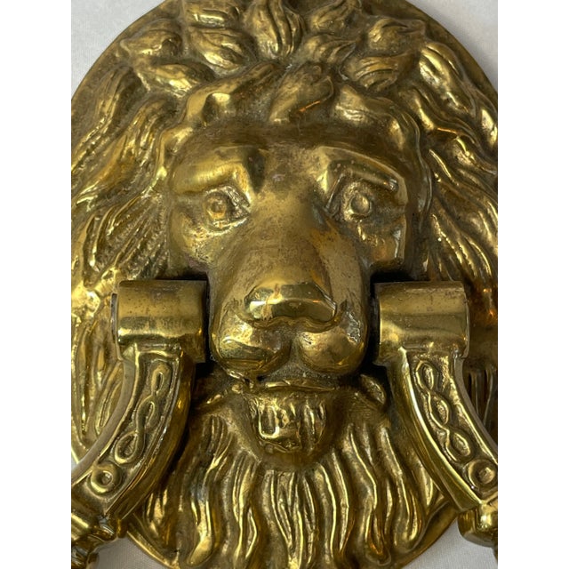 Ornate and powerful Lion Head Door Pull. Heavy solid brass with a handle that is 4 inches across on the interior which...