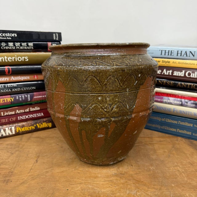 "About This Piece About This Piece This Shigaraki-style planter celebrates the unpredictable beauty of fire and clay. The...