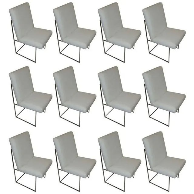 Mid-Century Modern Thin Series dining chairs designed by Milo Baughman. Newly reupholstered in white leather with chrome...