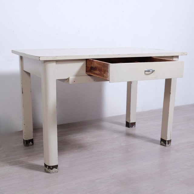 Beautiful dining table, original from the 50s and 60s made of wood, a drawer with compartments, a rolling pin and a...