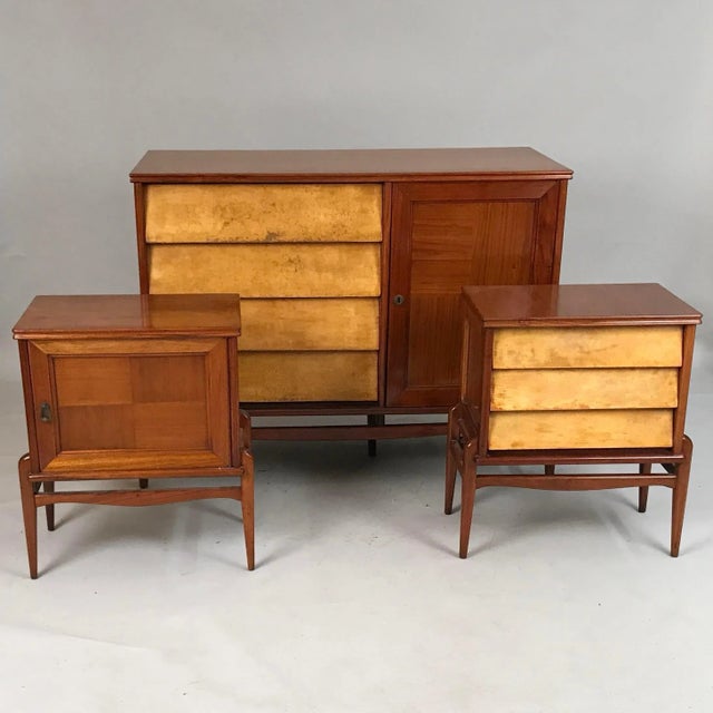This Circa 1940 Italian Parchment furniture set may be used as either a sideboard with side tables for a dining area or a...