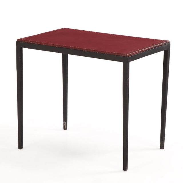 A sophisticated, handcrafted side table inspired by the refined minimalism of Jean-Michel Frank. This table features a...