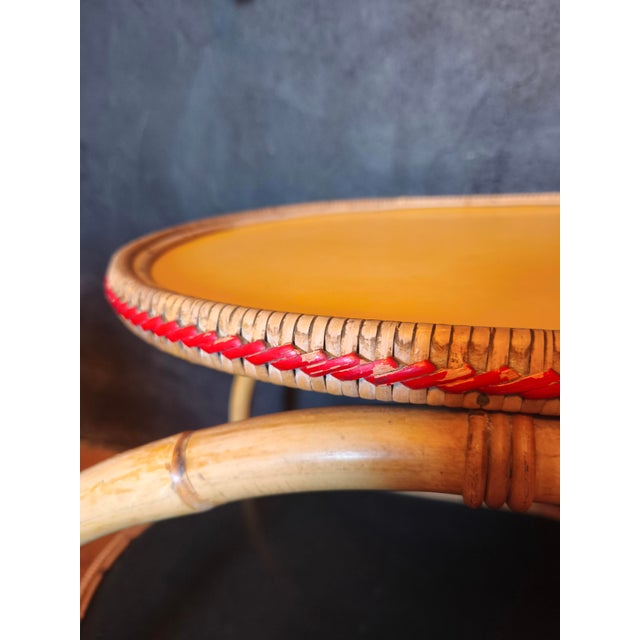 Very well-preserved bar cart from the 1950s Lower shelf in black Upper shelf in yellow Bamboo combined with rattan The...