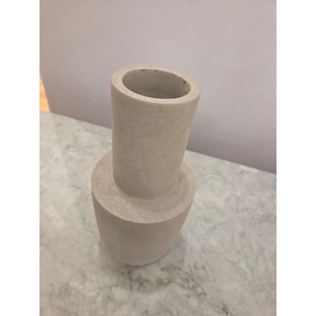Two tiered stone vase, textured ripple detail and white-stone coloring