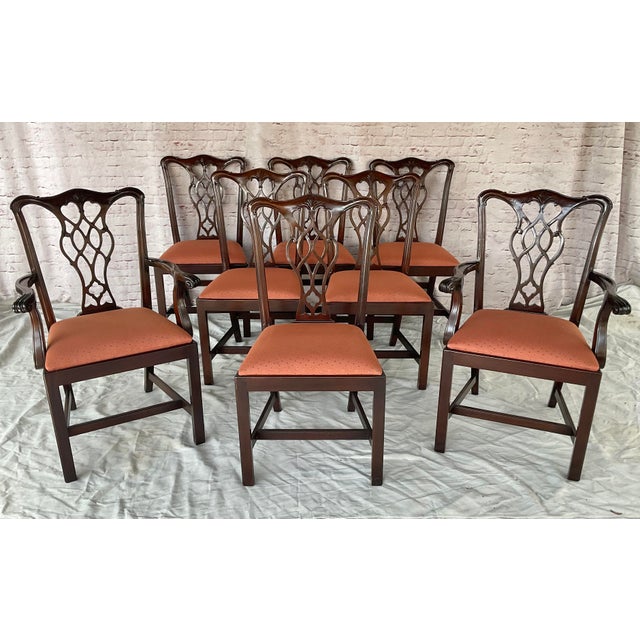 20th Century Set of Eight Chippendale-Style Mahogany Dining Chairs. There are two armchairs and six side chairs. Chairs...