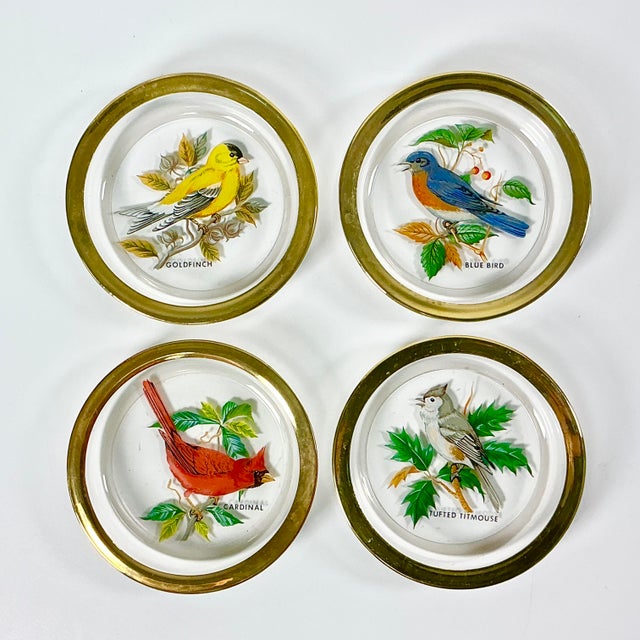 This is a lovely set of 4 Crystal coasters with deep cups and a gold rim. Each has a painting of a different bird...