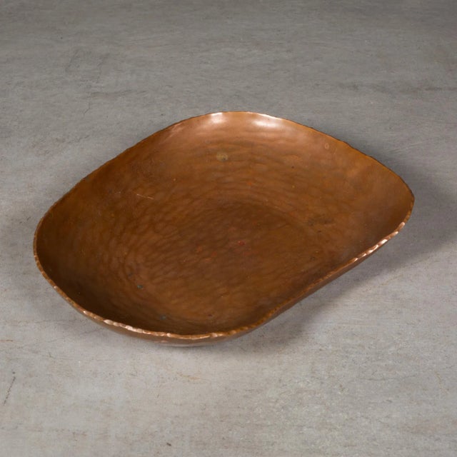 ABOUT A mid-century kidney shaped, hammered copper dish. Stamped "Made in Germany". CREATOR Unknown. Made in Germany. DATE...
