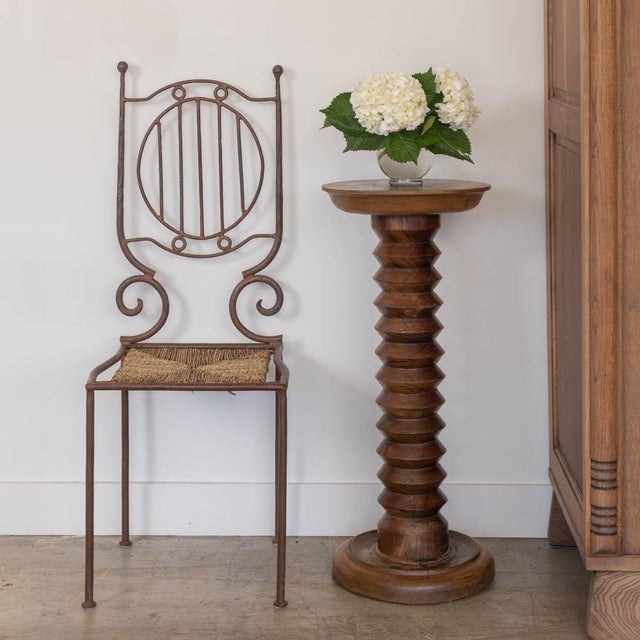 Beautiful carved wood pedestal table from France, 1940s. Made of solid wood with original finish. Great carved wood stem...