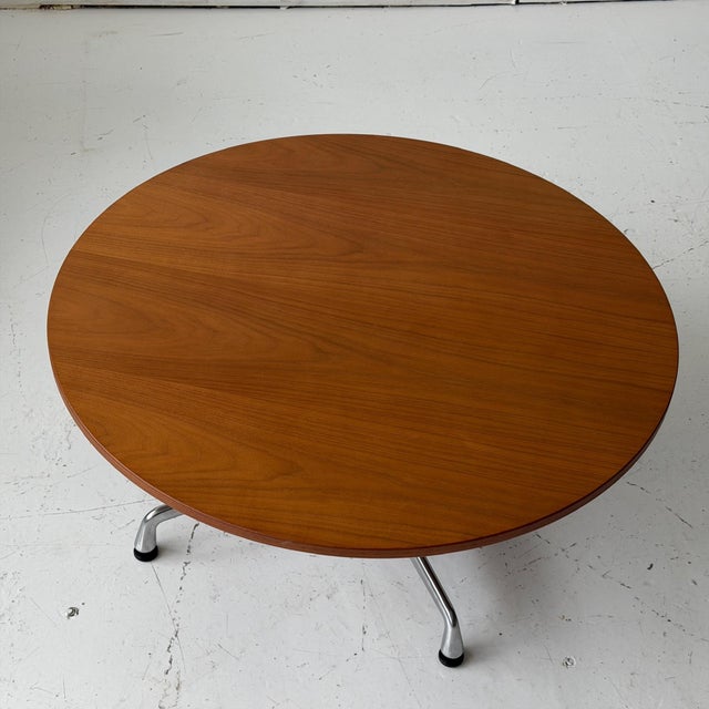 c. 2018. Walnut top with aluminum group base.