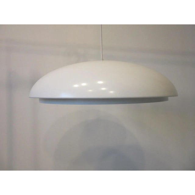 A nice cleanly designed mid century domed pendant chandelier with matching metal concentric louvered shade which snaps in...