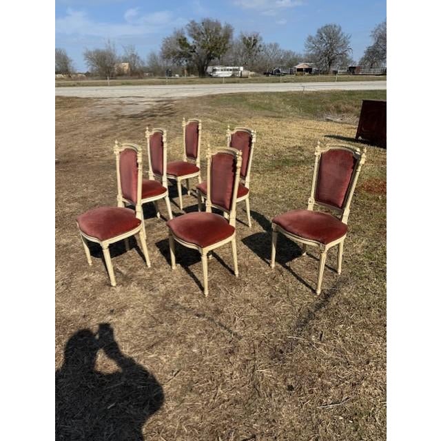 - A set of six 19th century Louis XVI-style dining chairs featuring classic square backs, fluted tapered legs, and carved...
