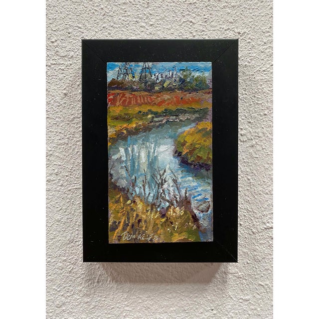 This oil on panel captures a serene landscape along the Highline Canal, showcasing a tranquil waterway reflecting the soft...