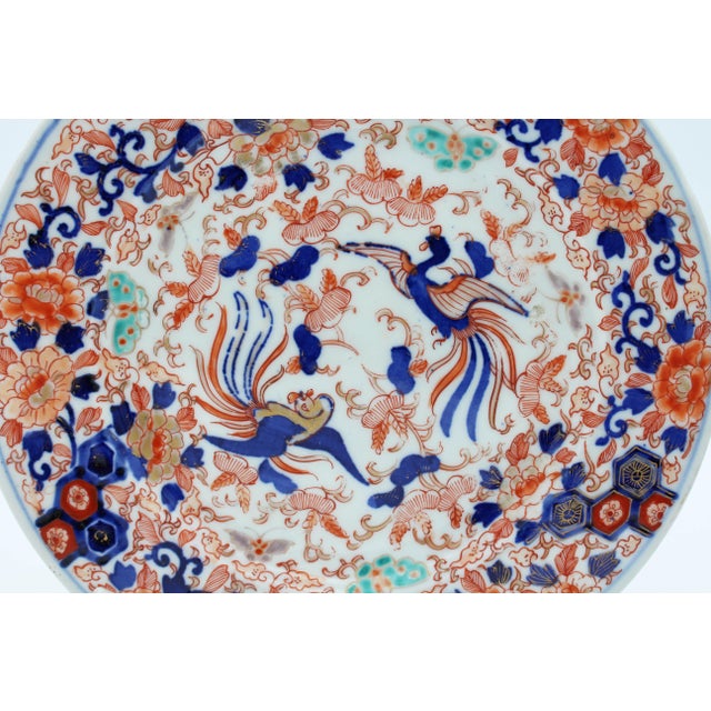 Late 19th century Meiji period Japanese Imari Plate. Extravagantly decorated with butterflies, floral & geometric motifs...