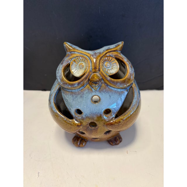 This sculptural ceramic owl candle holder showcases the organic beauty of mid-century studio pottery. Finished in a...