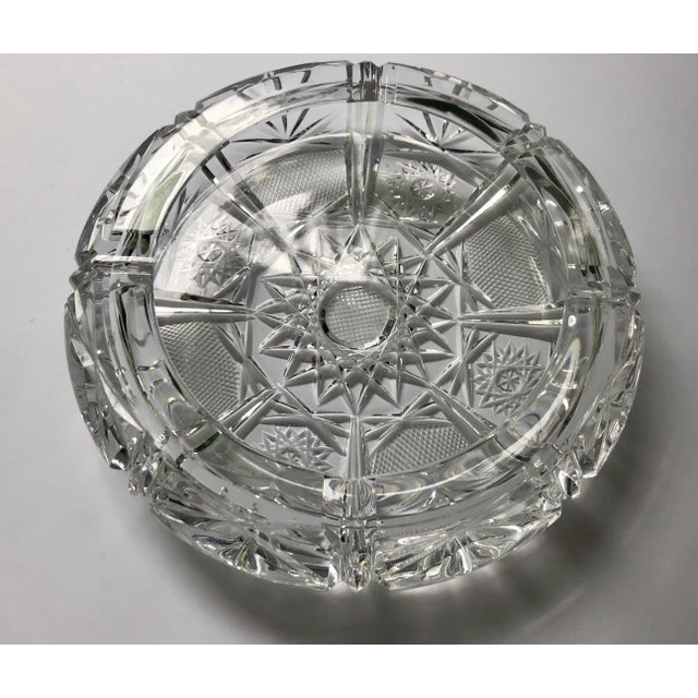 A beautifully mastered cut lead crystal ashtray in a disc shape. The Bohemian Czech style is American brilliant indicated...
