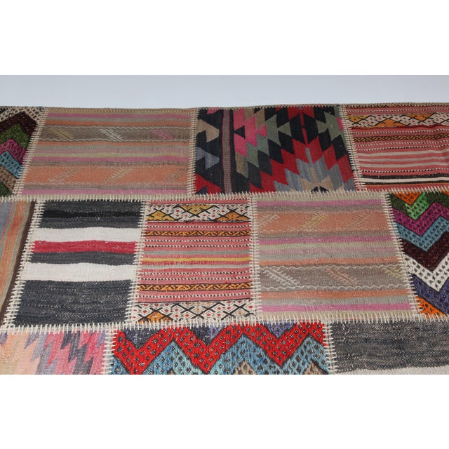 Textile Mid 20th Century Bohemian Turkish Kilim Patchwork Rug With Tribal Motifs -5' 7'' X 9' 10'' For Sale - Image 7 of 12