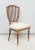 Set of Eight Dining Chairs in the Neoclassic Manner - chairs are hand-painted and gilded with fluted legs and shield-backs...