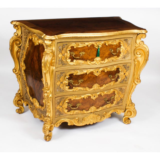 This is a gorgeous antique pair of Italian Venetian walnut and giltwood serpentine bombe' commodes, dating from the late...