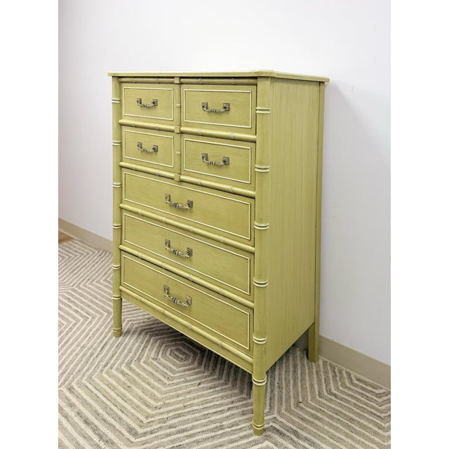 Bring timeless tropical and Hollywood Regency elegance to your space with this vintage Henry Link “Bali Hai” tallboy...